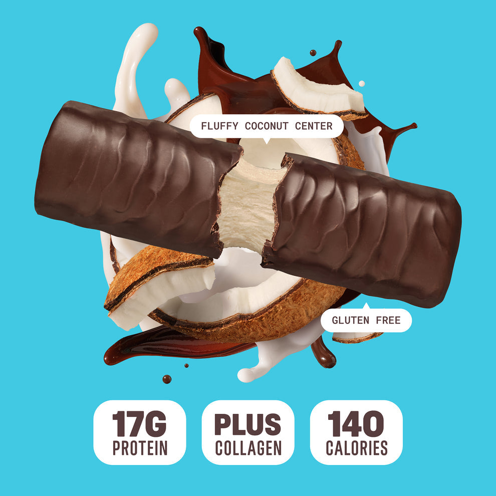 Built Bar Puffs Canada – Coconut Protein Bar 40g partially unwrapped showing chocolate coating and fluffy coconut center on blue background