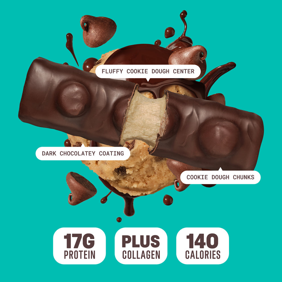Built Bar Puffs Canada – Cookie Dough Chunks Protein Bar 40g partially unwrapped showing dark chocolatey coating with cookie dough  chunks on top and fluffy cookie dough center on green background
