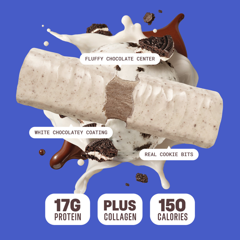 Built Bar Puffs Canada –Cookiesn'Cream Protein Bar 40g partially unwrapped showing white chocolatey coating and fluffy chocolate center with real cookie bits on blue background
