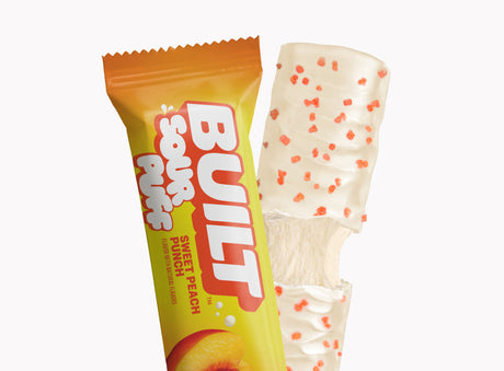 Built Bar Puffs Canada – Sour Puff Sweet Peach Protein Bar 40g showing orange and white coating on white background