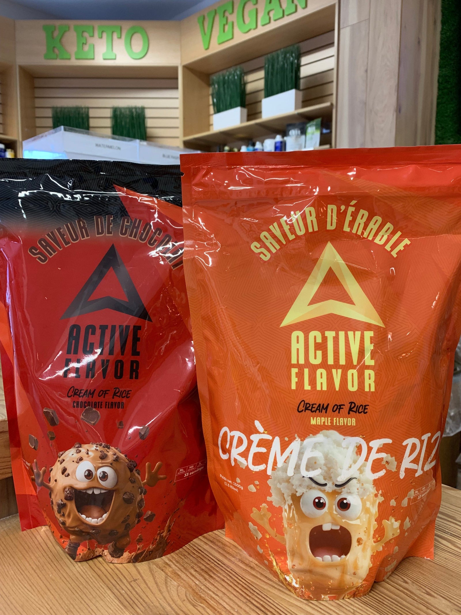 Two bags of Active Flavor Cream of Rice, maple and chocolate flavors, displayed on a wooden counter at Vikings Nutrition in Montreal