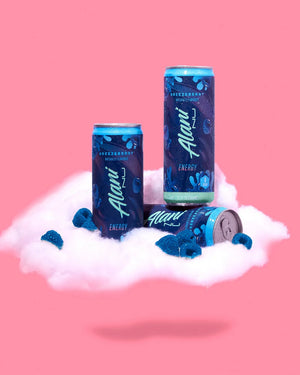 Three cans of Alani Nu energy drink on a cloud with a pink background