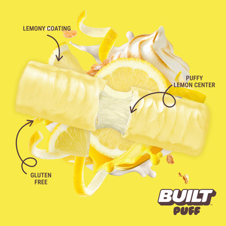 Built Bar Puffs Canada – Lemon Meringue Pie Protein Bar 40g partially unwrapped showing lemony coating and fluffy lemon center on yellow background