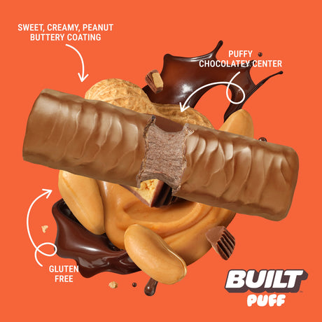 Built Bar Puffs Canada – Peanut Butter Cup Protein Bar 40g partially unwrapped showing creamy peanut and chocolate center on orange background
