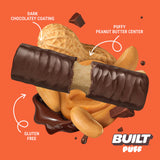 Built Bar Puffs Canada – Peanut Butter Protein Bar 40g partially unwrapped showing dark chocolatey coating and fluffy peanut butter center on orange background