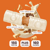 Built Bar Puffs Canada – Pumpkin Cookie Chunk Protein Bar 40g partially unwrapped showing white chocolatey coating with cookie chunks on top and fluffy pumpkin center on orange background
