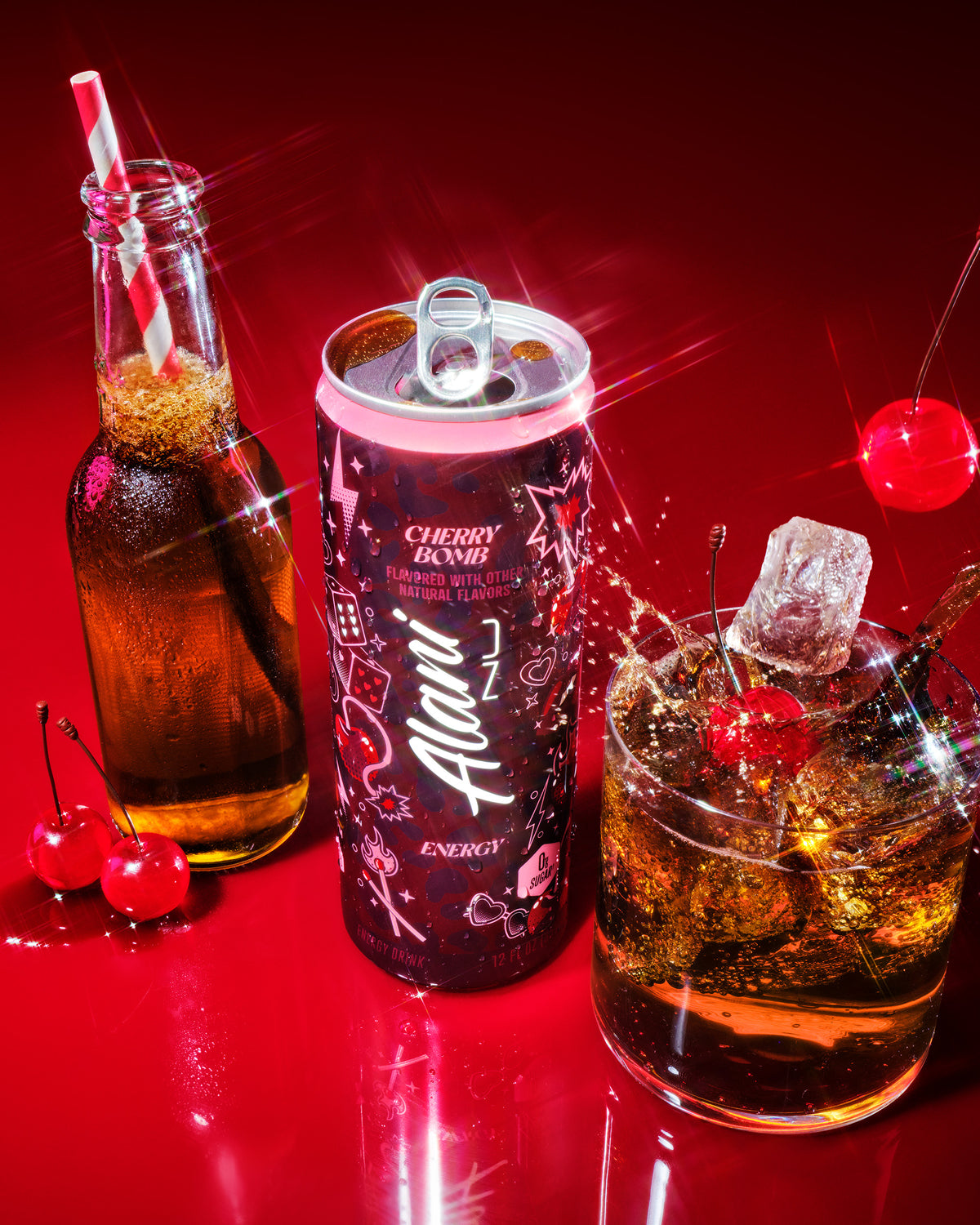 Alani Cherry Bomb energy drink can with a bottle, glass, and cherries on a red background