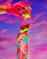 Colorful soda can with cherry and lime garnish against a vibrant purple sky.