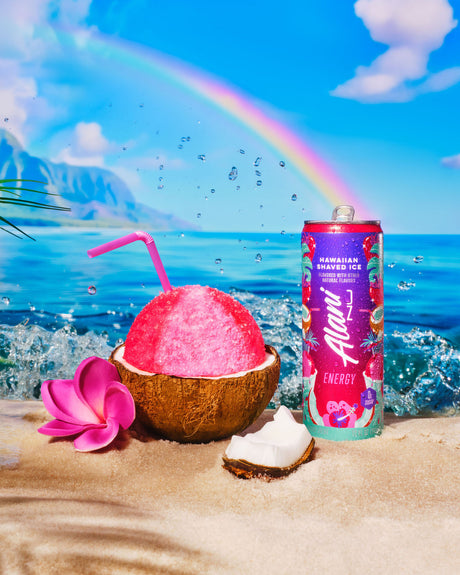 Can of Hawaiian Energy drink with pink coconut drink on a beach with rainbow