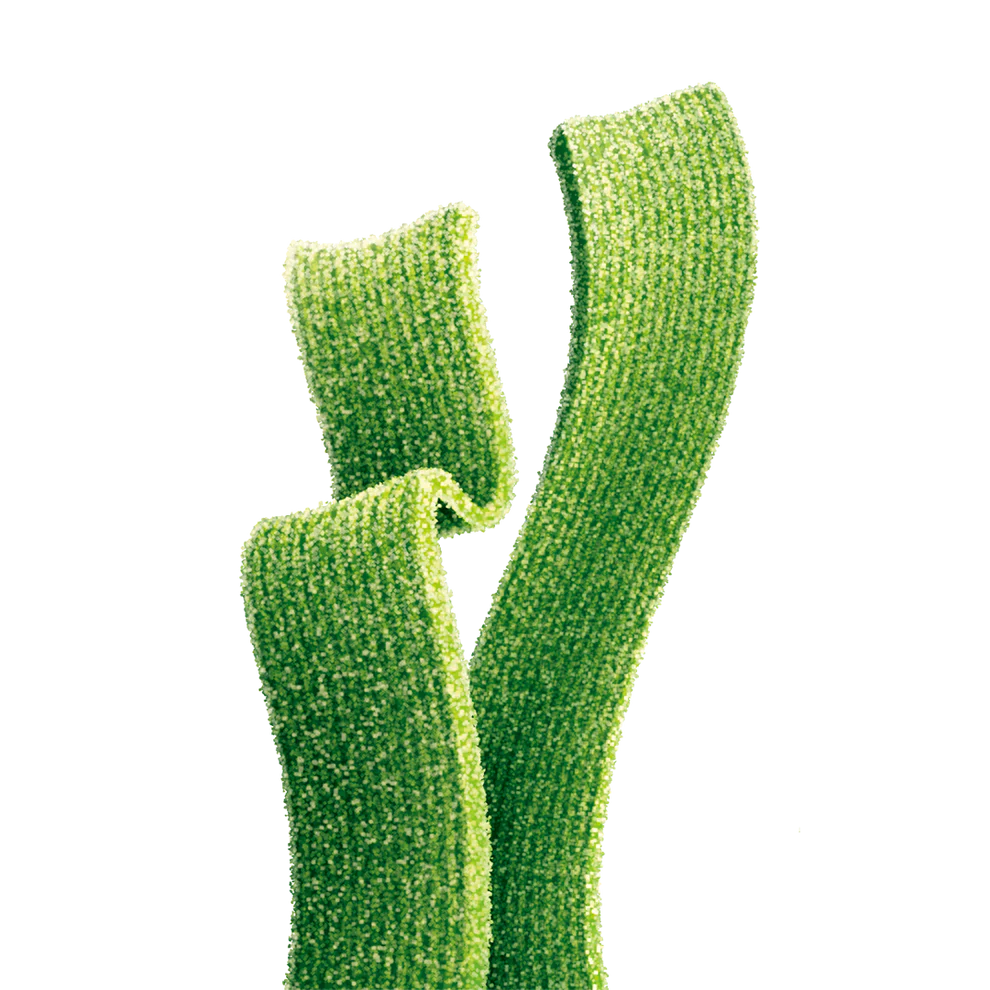 Close-up of Joyride Sour Green Apple Strips, chewy sour candy strips coated in sugar