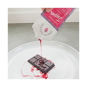 Protein Basics™ Raspberry Topper poured over dark chocolate – 16g protein